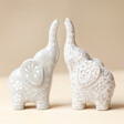 Ceramic Elephant Ring Holders on neutral background