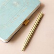 Close Up of Gold Pen With Designworks Ink Gratitude Journal