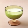 Paddywax Misted Lime Scented Candle and Goblet on Pink Surface