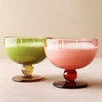 Pink and Green Paddywax Scented Candles and Goblets on Pink Surface