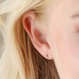 Model Wearing Tiny Crescent Moon Stud Earrings in Gold