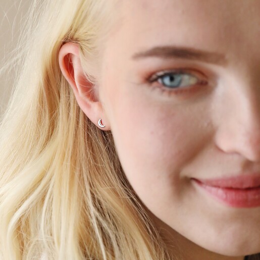 Tiny Crescent Moon Stud Earrings in Silver on Model
