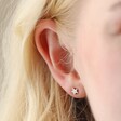 Model Wearing Tiny Star Stud Earrings in Silver