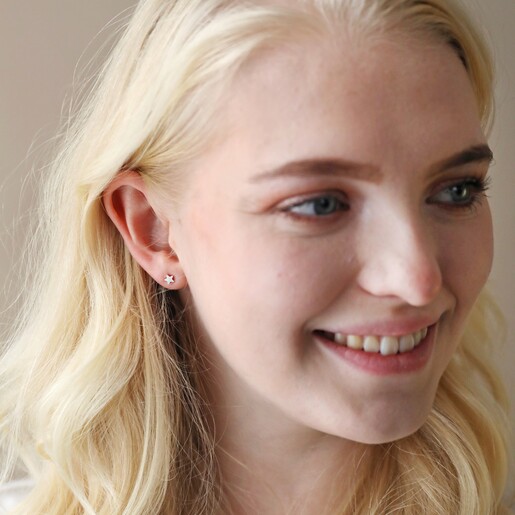 Model Wears Tiny Star Stud Earrings in Silver