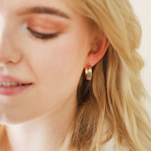 Model Wearing Wide Rainbow Crystal Hoop Earrings in Gold