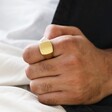 Close Up of Model Wearing Men's Brushed Gold Stainless Steel Signet Ring