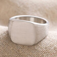 Men's Brushed Stainless Steel Signet Ring on Beige Fabric