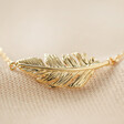 Gold Feather Necklace close up