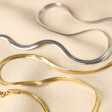 Herringbone Chain Necklaces in Silver and Gold on Fabric