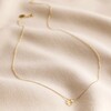 Semi-Precious Citrine Stone Teardrop Pendant Necklace in Gold on Rippled Beige Fabric