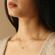 Brunette Model Wearing Semi-Precious Pink Thulite Stone Teardrop Pendant Necklace in Gold