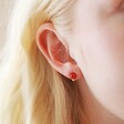 Close Up of Model Wearing Red Enamel Mushroom Stud Earrings in Gold