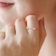 Close Up of Model Wearing Adjustable Crystal Heart Ring in Rose Gold