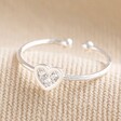 Adjustable Crystal Heart Ring in Silver on Beige Fabric