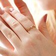 Leaf and Crystal Ring in Gold on Model Hands Together