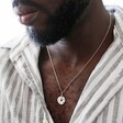 Model Wearing Spinning Disc Pendant Necklace in Platinum Close Up 