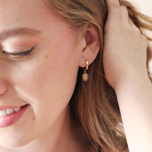 Model Wears Sunburst Huggie Earring in Gold
