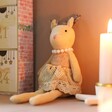 Festive Reindeer Decoration Against Natural Coloured Wall with Candles