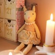 Festive Reindeer Decoration in Dimmed Room with Candles and Advent Calendar