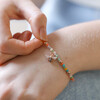 Model Wearing Colourful Beaded Bee Bracelet in Rose Gold Holding Beads