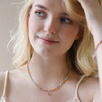 Model Wearing Colourful Beaded Bee Necklace in Rose Gold with Hand in Hair