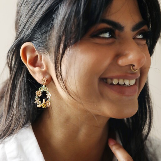 Crystal Flower and Enamel Bee Drop Earrings on Model Smiling