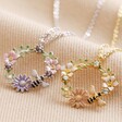 Crystal Flower and Enamel Bee Pendant Necklaces in Silver and Gold on Fabric