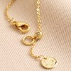 Close Up of Adjustable Slider on Opal and Enamel Floral Pendant Necklace in Gold
