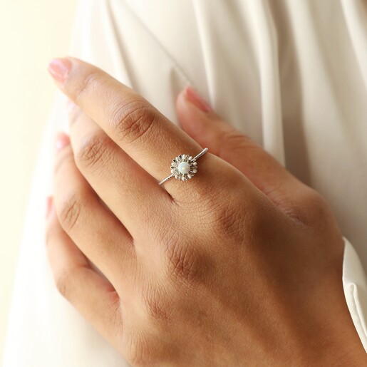 Model Wearing Opal and Enamel Floral Ring in Silver Hand on Arm