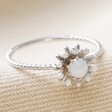 Opal and Enamel Floral Ring in Silver on Beige Coloured Background