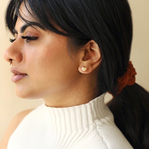 Shell Heart Stud Earrings in Gold on Model