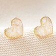 Shell Heart Stud Earrings in Gold on Neutral Fabric