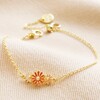 Triple Enamel Flower Chain Bracelet in Gold on Neutral Fabric