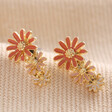 Triple Enamel Flower Stud Earrings in Gold on Neutral Fabric