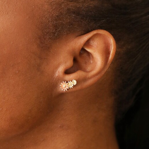Close Up of Earrings on Model Model Wearing Triple Enamel Flower Stud Earrings in Gold