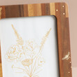 Close Up of Wooden Bee Photo Frame with Gold Detailing