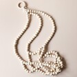Wooden Beaded Planter Hanger on Neutral Background