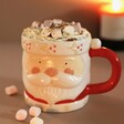 Ceramic Father Christmas Mug in Candle Lit Room with Hot Chocolate and Marshmallows
