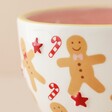 Close Up of Ceramic Gingerbread Mug with Gingerbread House on Neutral Background