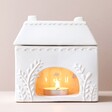 Back of Ceramic House Wax Melt Burner Showing Tea Light Lit