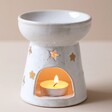Ceramic Starry Wax Melt Burner with Tealight Inside on Beige Background
