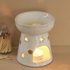 Lit Up Ceramic Starry Wax Melt Burner in Darkened Room