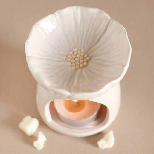 Top of Pink Blossom Ceramic Wax Melt Burner Showing Flower with Lit Tealight Inside and Wax Melt Surrounding