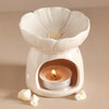 Pink Blossom Ceramic Wax Melt Burner with Lit Tealight Inside Surrounded by Pieces of Wax Melt