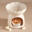 Pink Blossom Ceramic Wax Melt Burner with Lit Tealight Inside Surrounded by Pieces of Wax Melt