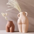 Porcelain Love Handles Vase and Brown Bum Vase with Grasses