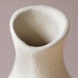 Close Up of Spout on Rounded Neutral Ceramic Vase
