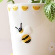 Close Up of Bumblebee on Small Bee Ceramic Planter and Tray