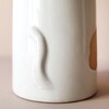Close Up of Tail on Back of Textured Ceramic Cat Vase