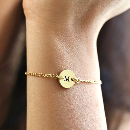 Close Up of Model Wearing Personalised Initial Disc and Figaro Chain Bracelet